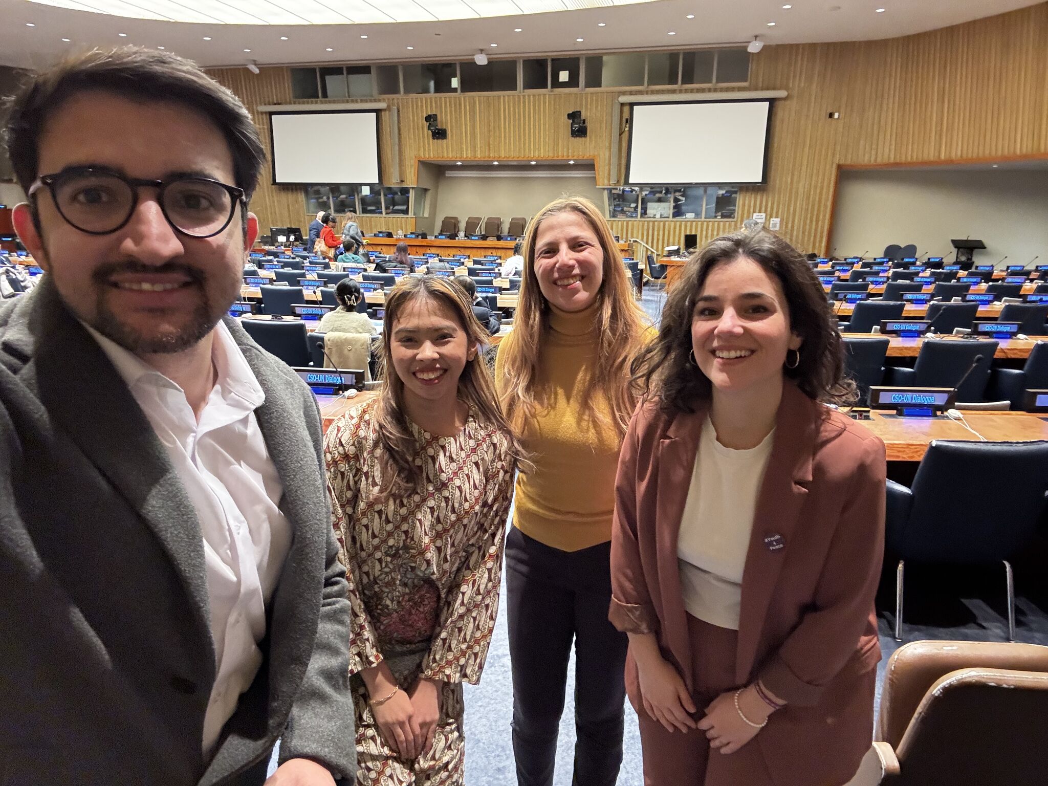 members standing in the conference room