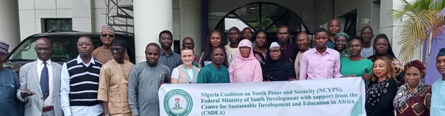 participants standing in front of the building