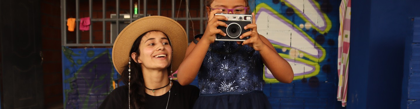 young girl taking a photo