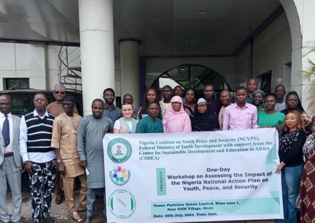 participants standing in front of the building